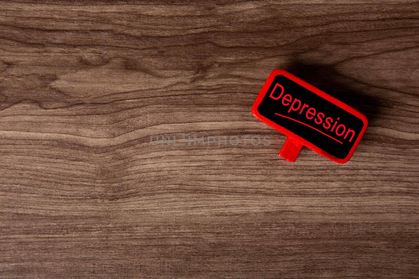 Red tag with Depression words on wooden bacground. Health Conceptual