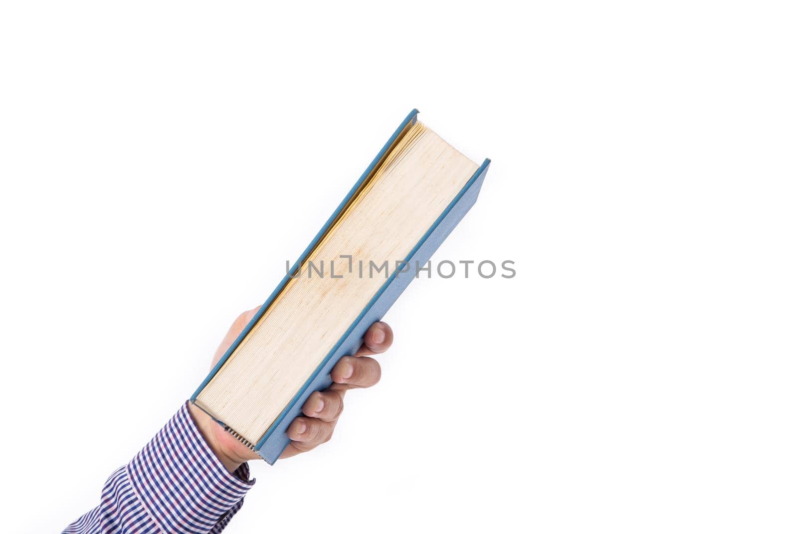 Male hand holding a book isolated on a white background,