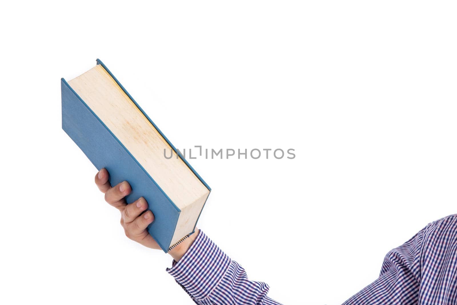 Male hand holding a book isolated on a white background,