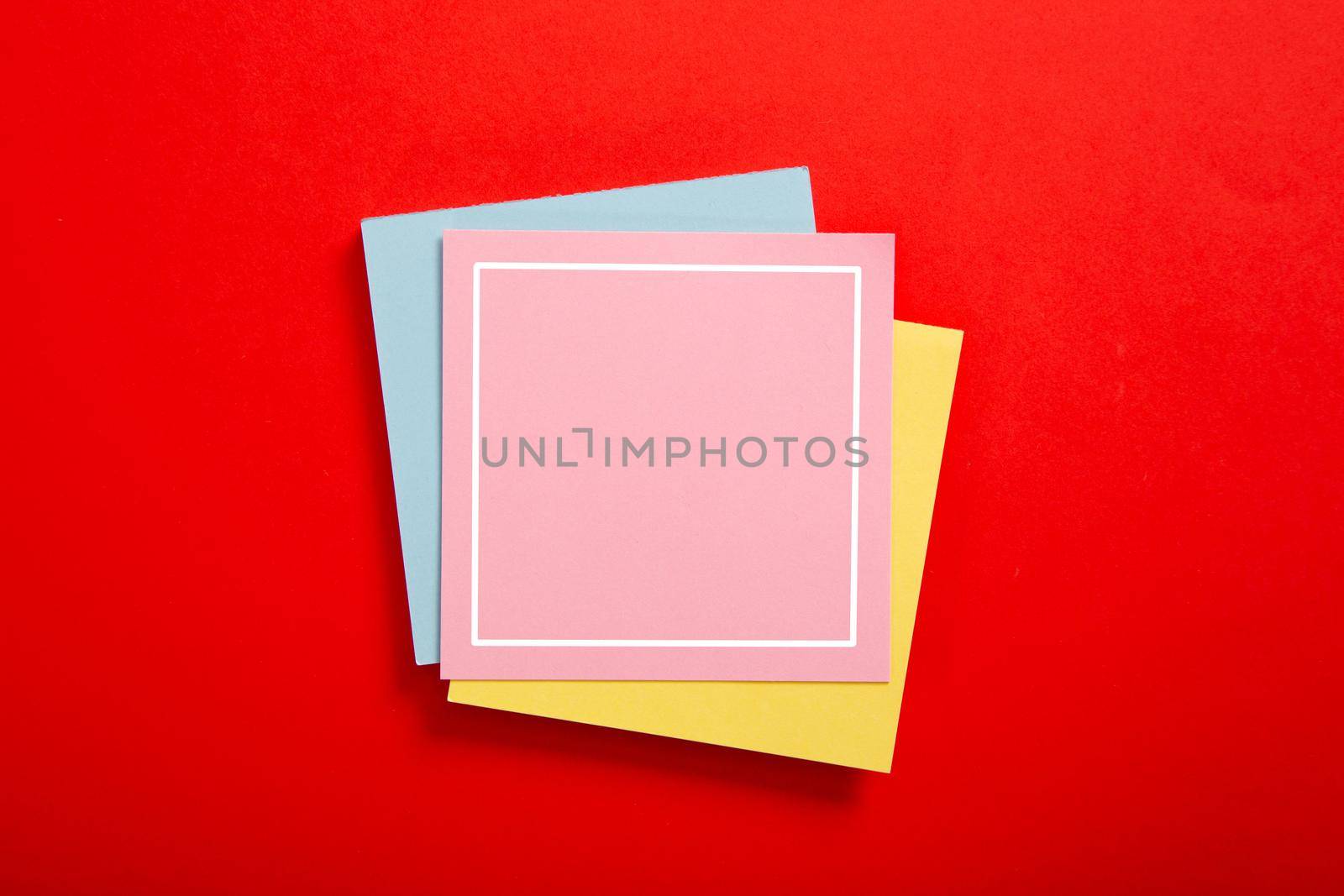 Blank sticky note on red background