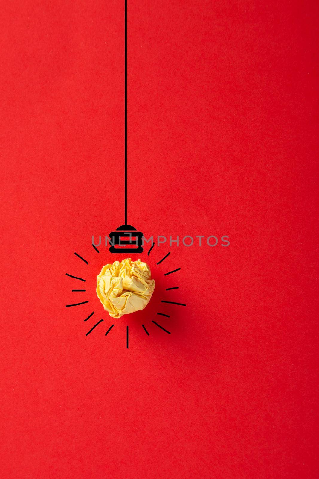 Creative idea, Inspiration, New idea and Innovation concept with Crumpled Paper light bulb on red background.