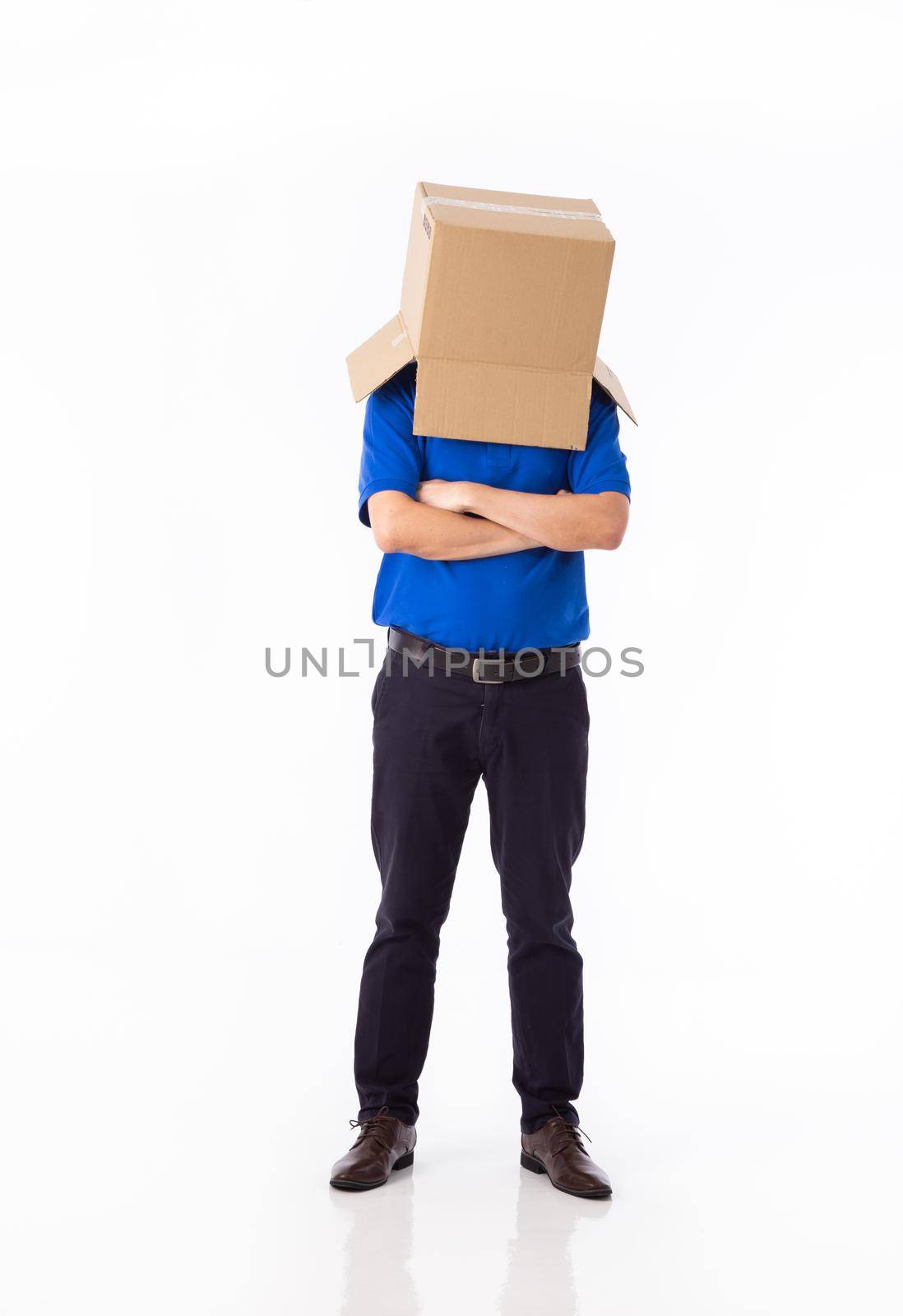 man in a blue T-shirt with a cardboard box on his head makes a gesture with his hands by tehcheesiong