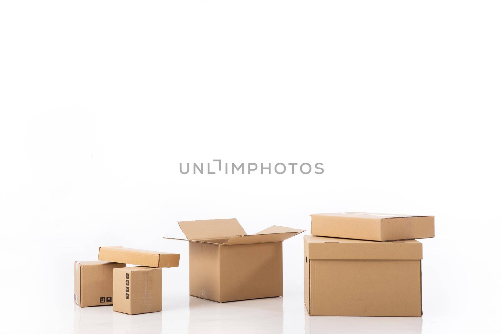 Group of cardboard boxes isolated on white background by tehcheesiong