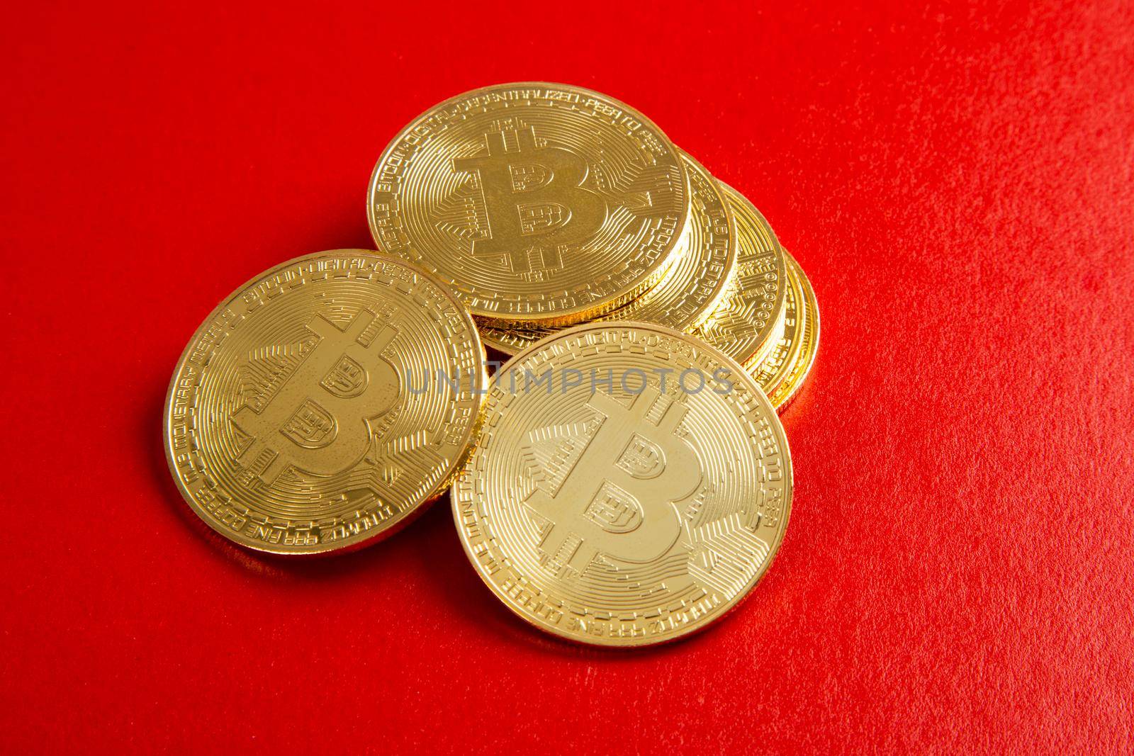 close up on bitcoin on red background