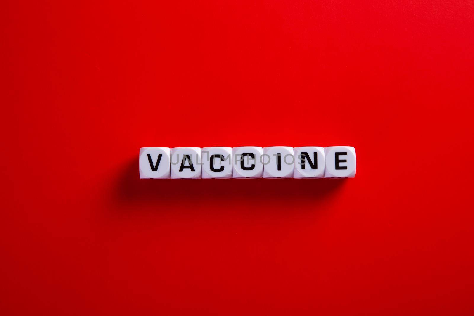 Medical covid-19 concept. Words of 'vaccine' on red background