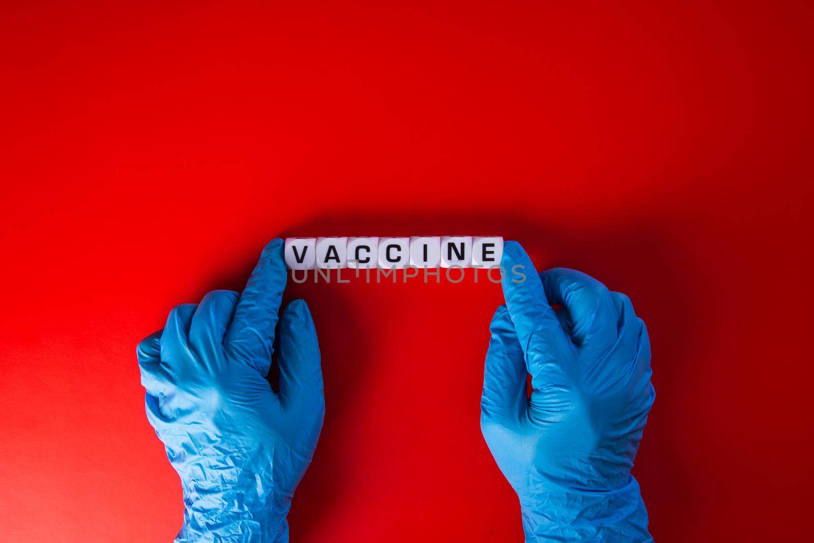 Doctor hand  with words 'vaccine'. Medical covid-19 concept