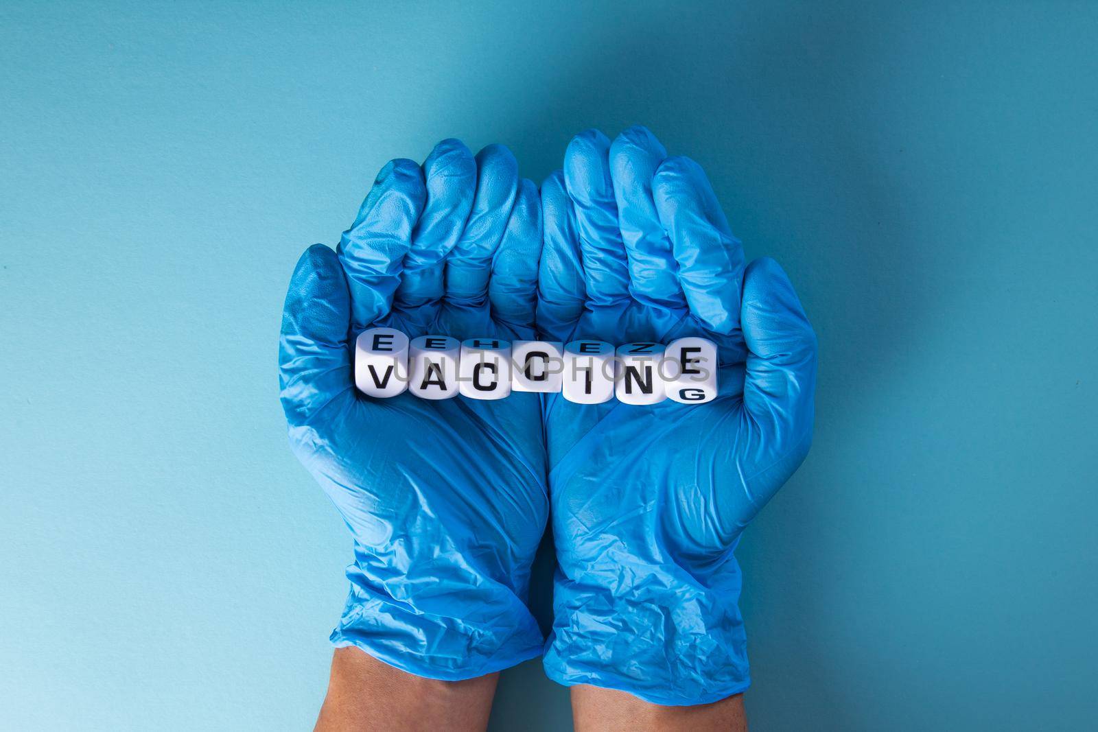 Doctor hand  with words 'vaccine'. Medical covid-19 concept