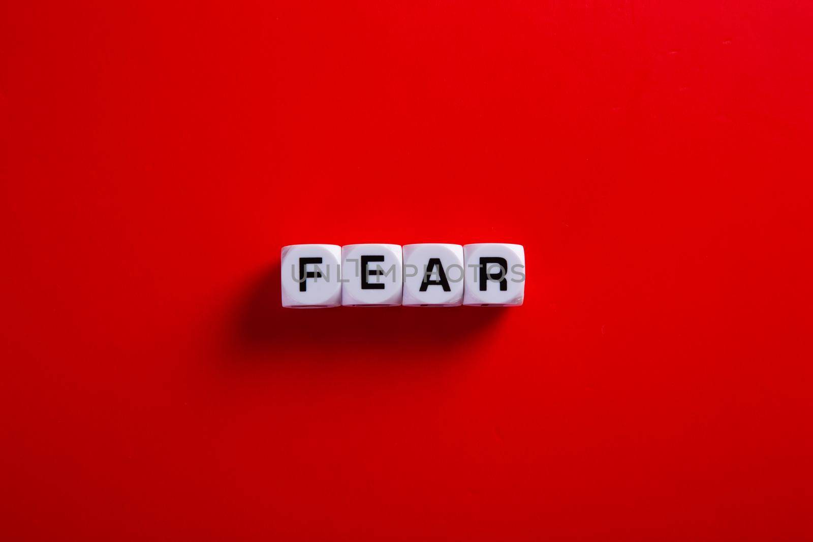 Medical covid-19 concept. Words of 'fear' on red background