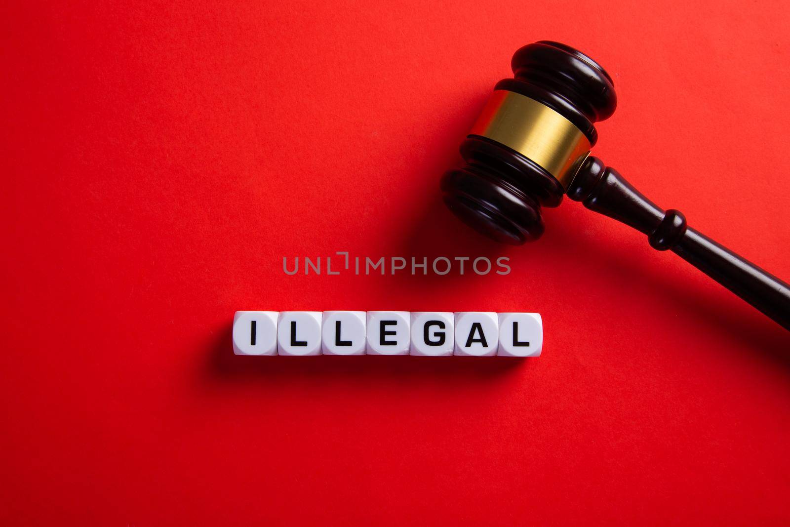 Illegal word on red background. Immigration law.