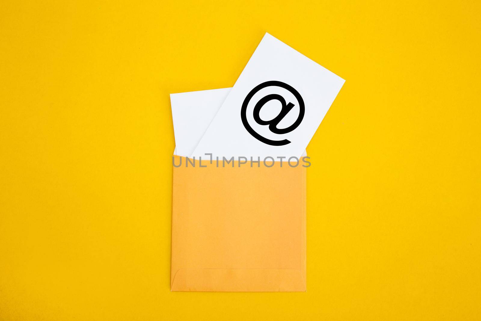 Envelope with email symbol on yellow background - Concept of corporate communication