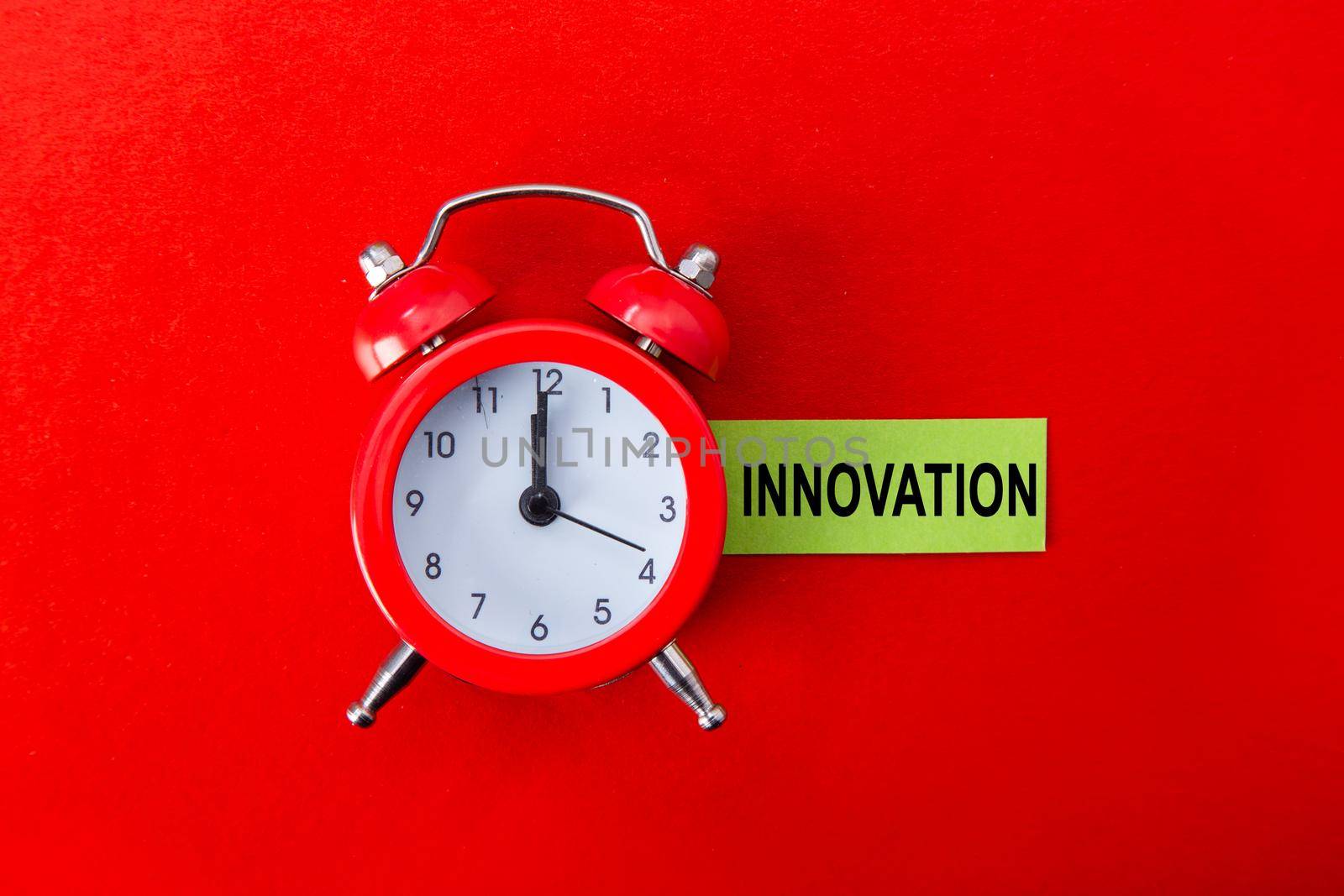 Innovation time has come, Clock on red background