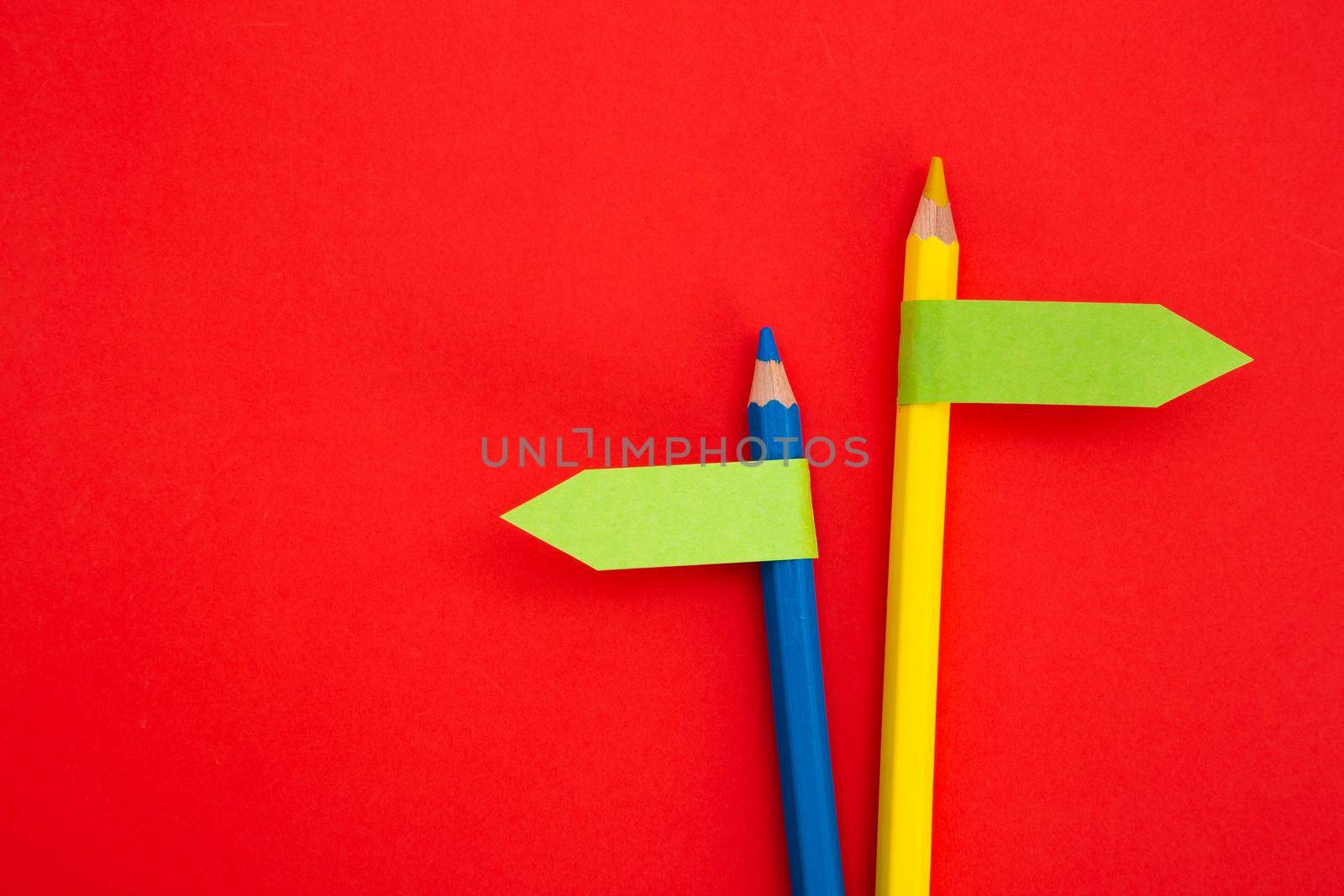 color pencil with direction indicator on color background