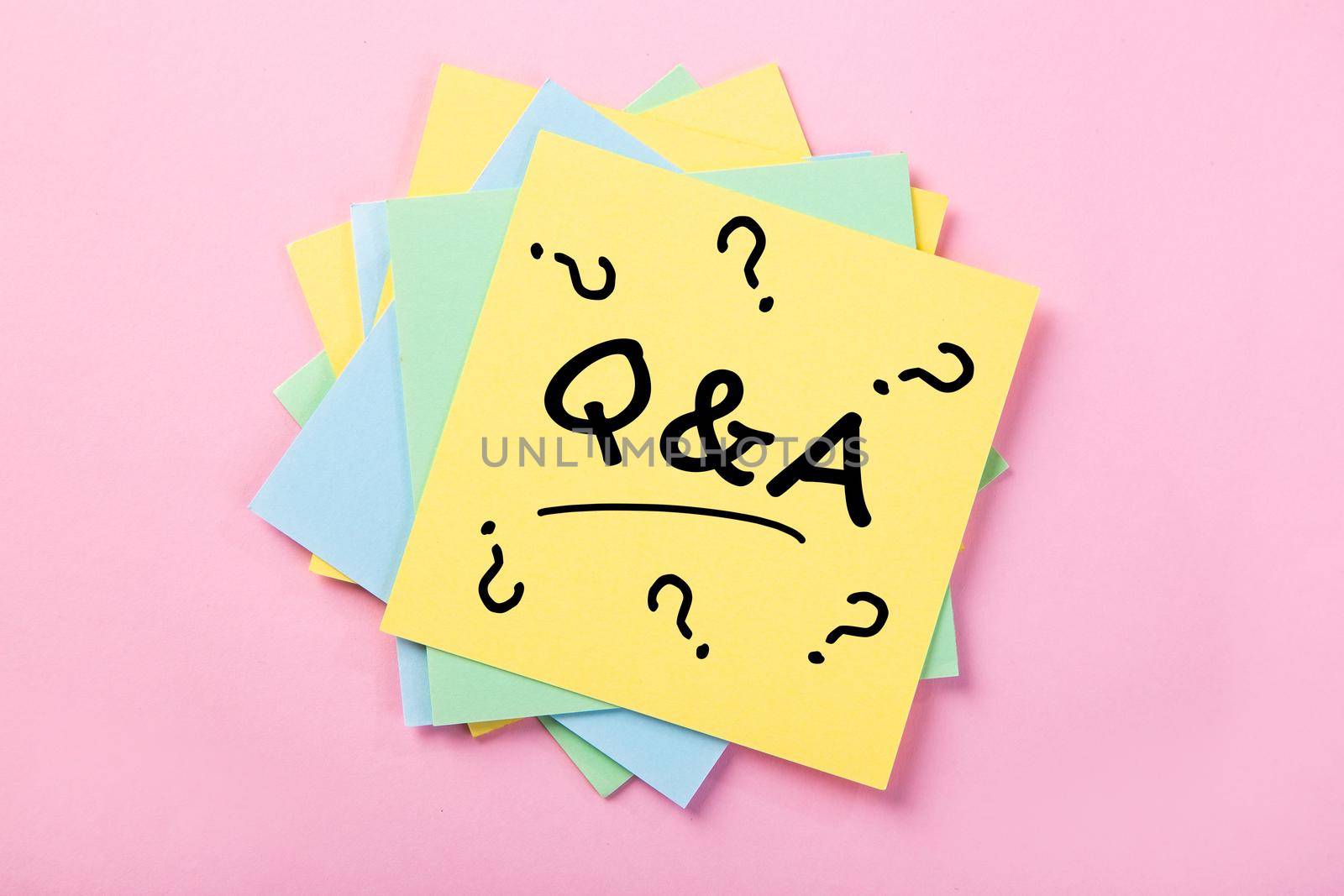 Sticky note on pink background, Question And Answer
