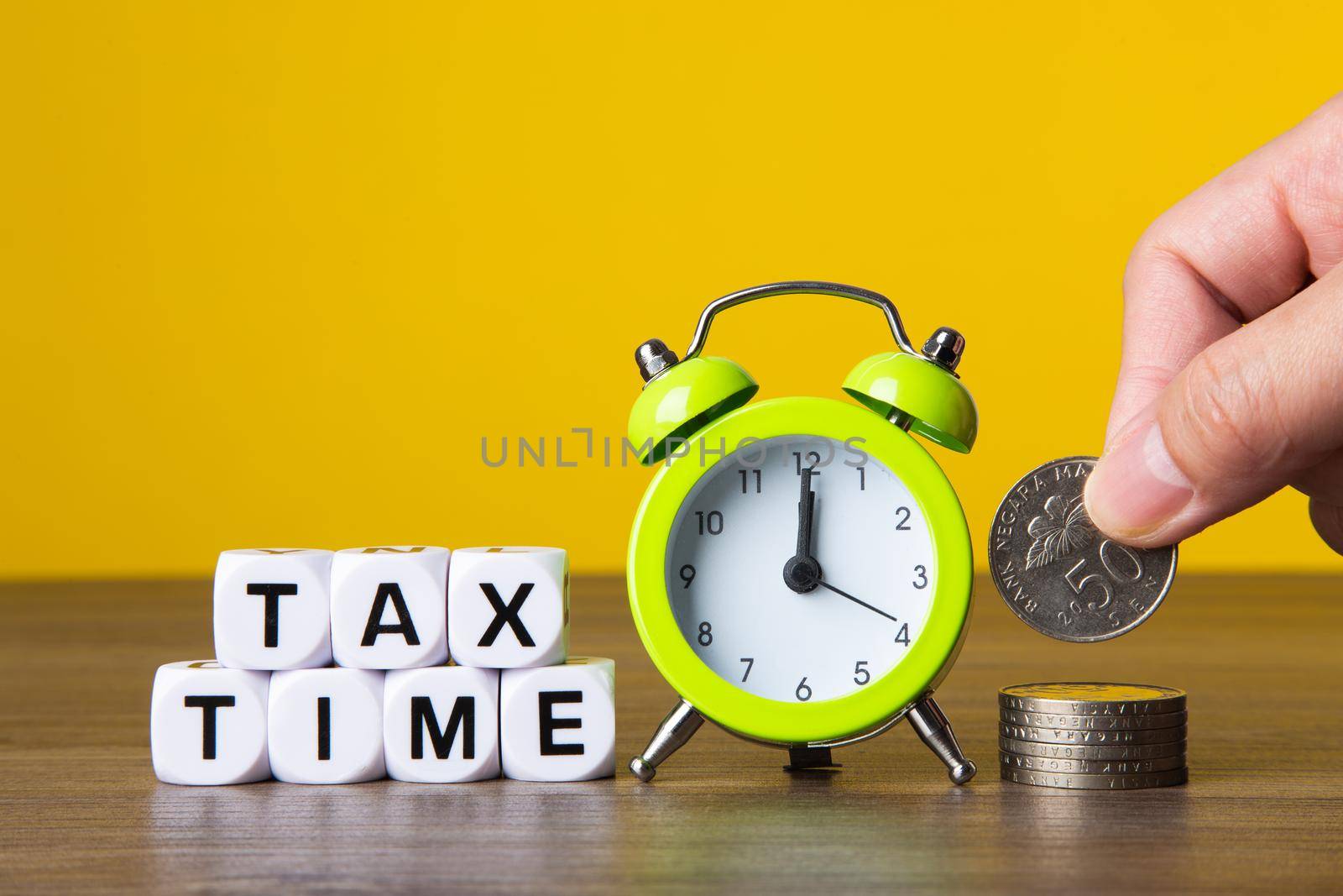 Time For Taxes Reminder Concept on yellow background