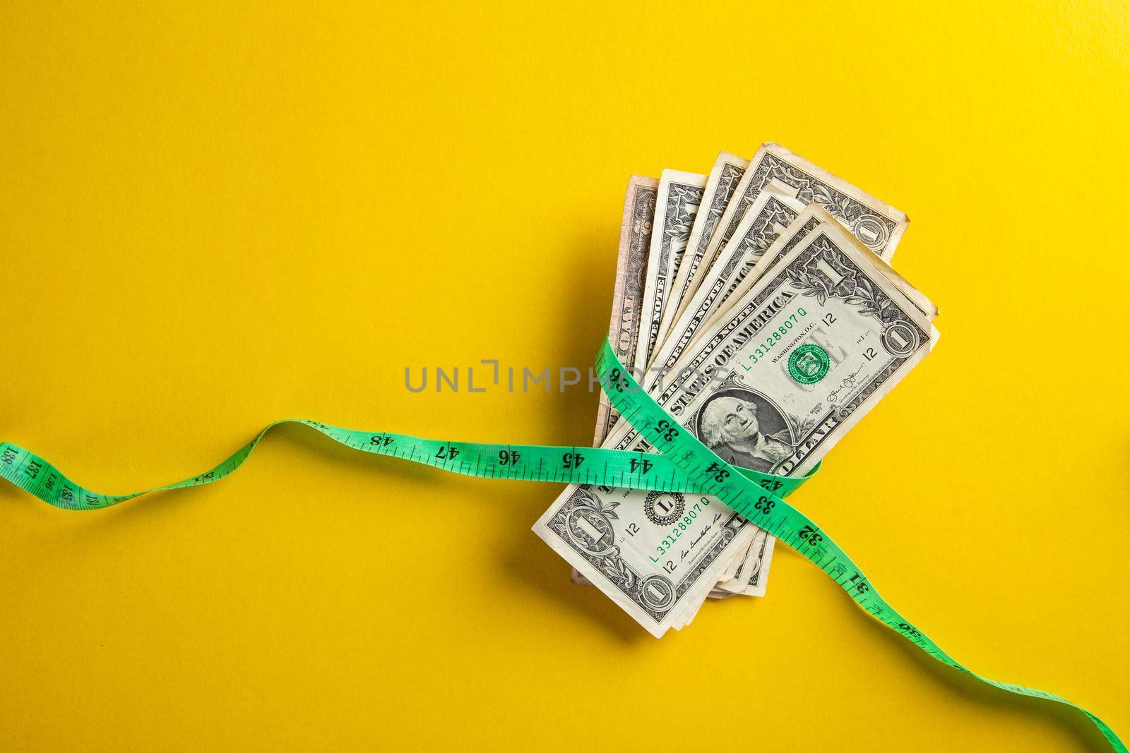 Money with a tape measure. Inflation rates. Price growth.