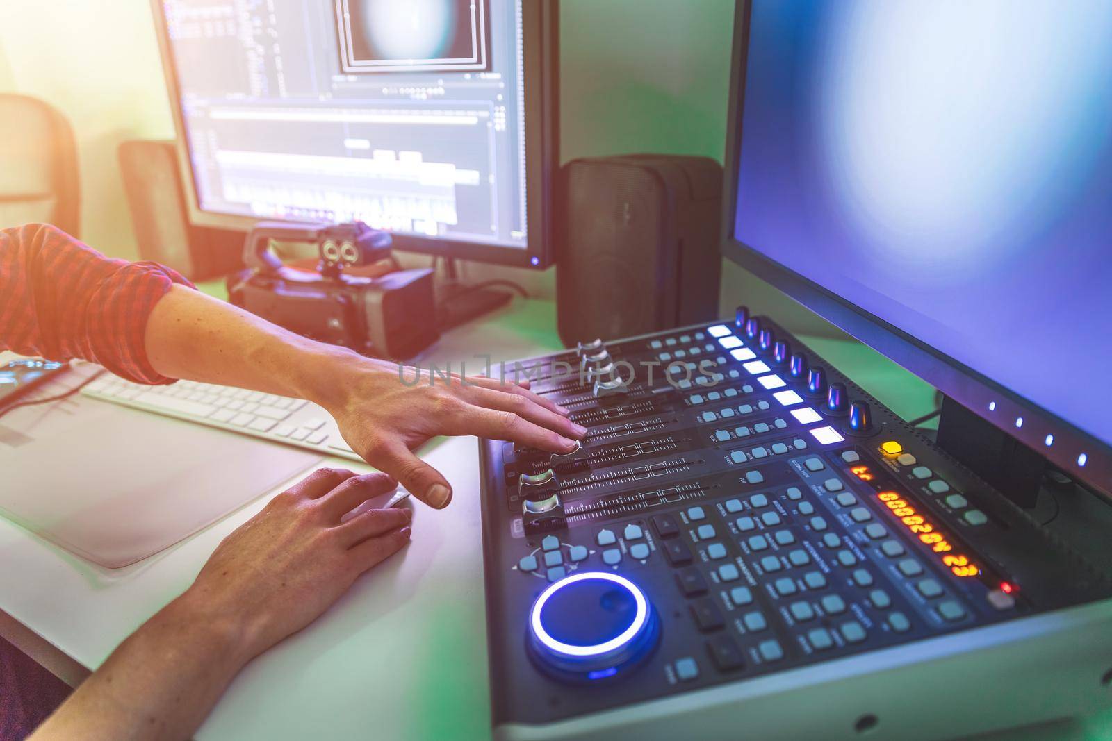 Video editing, recording and cutting room with monitors and sound mixing desk
