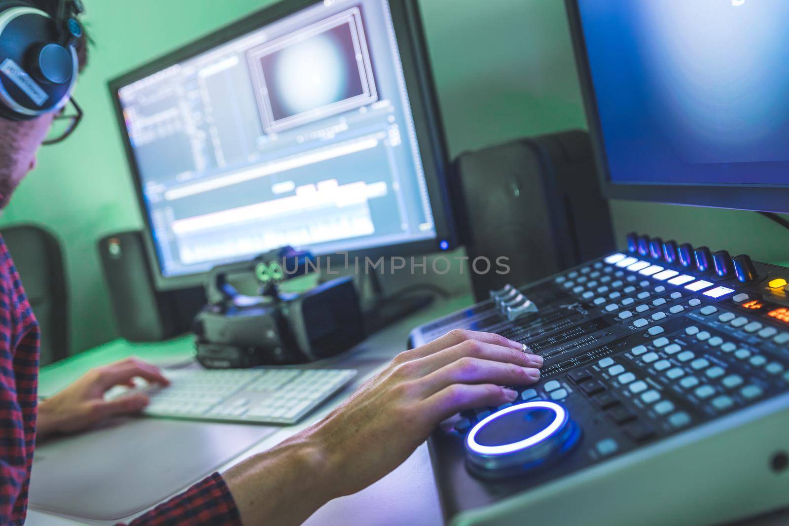 Video editing, recording and cutting room with monitors and sound mixing desk