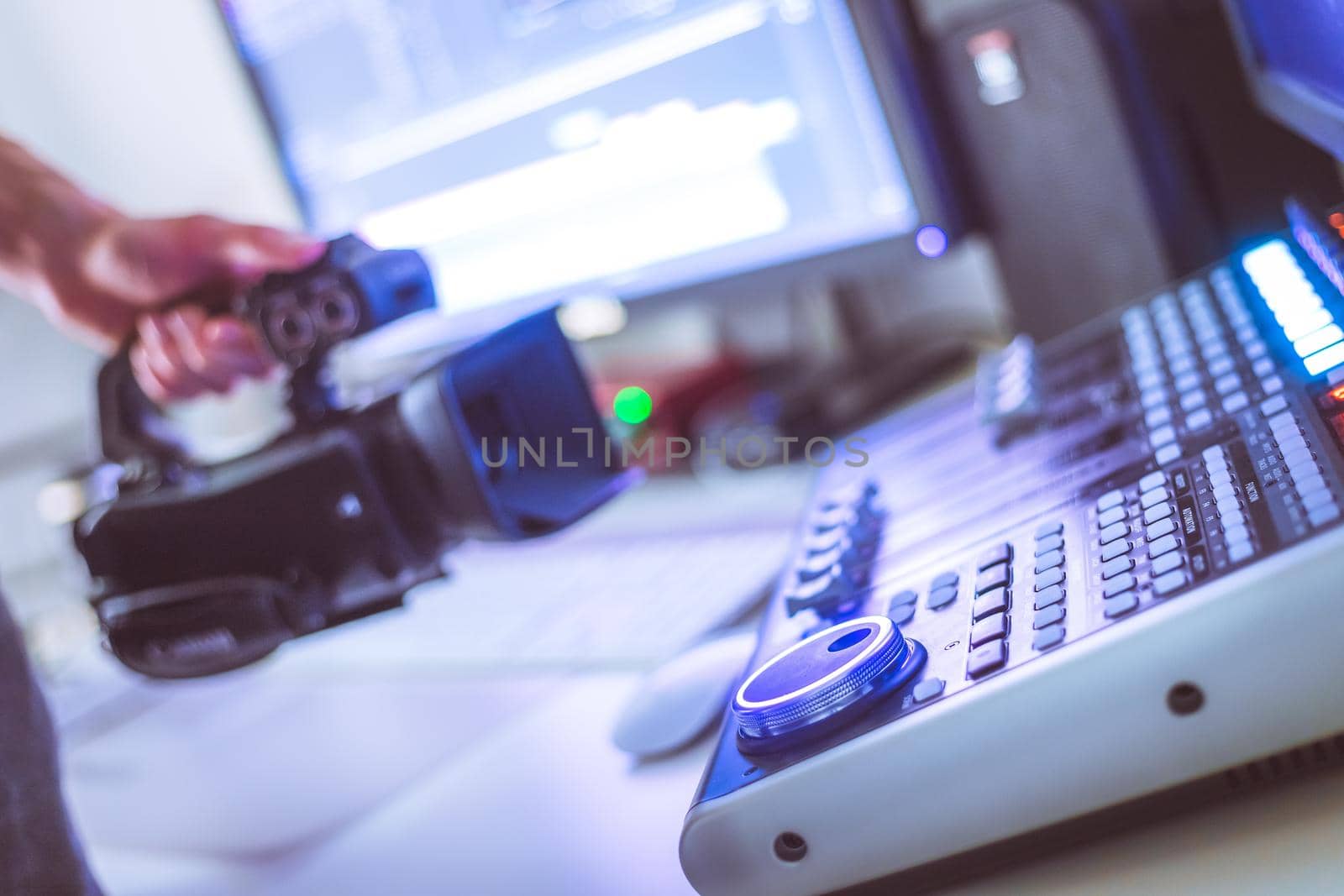 Video editing, recording and cutting room with monitors, camera and sound mixing desk