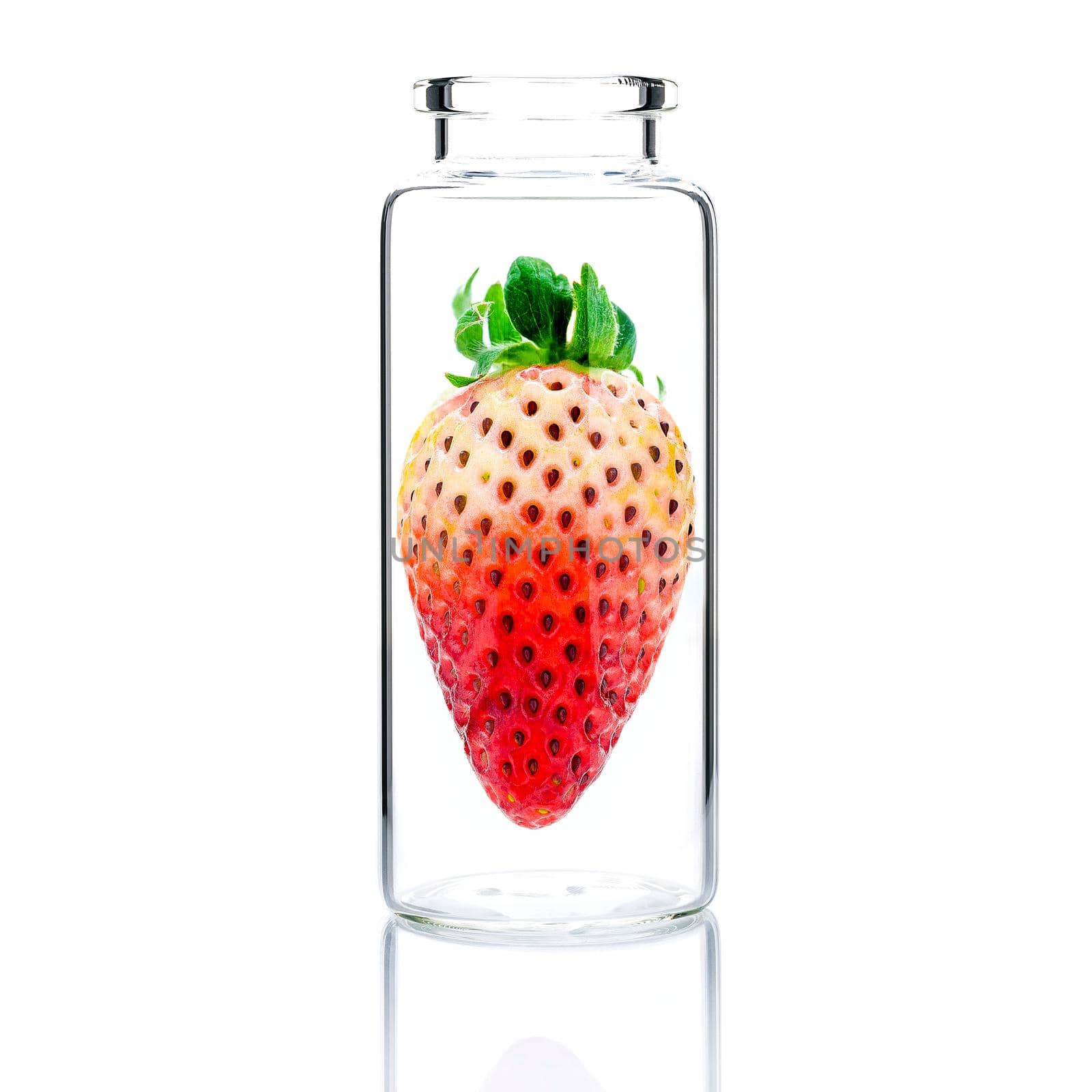 Homemade skin care with fresh strawberry in a glass bottle isolated on white background.