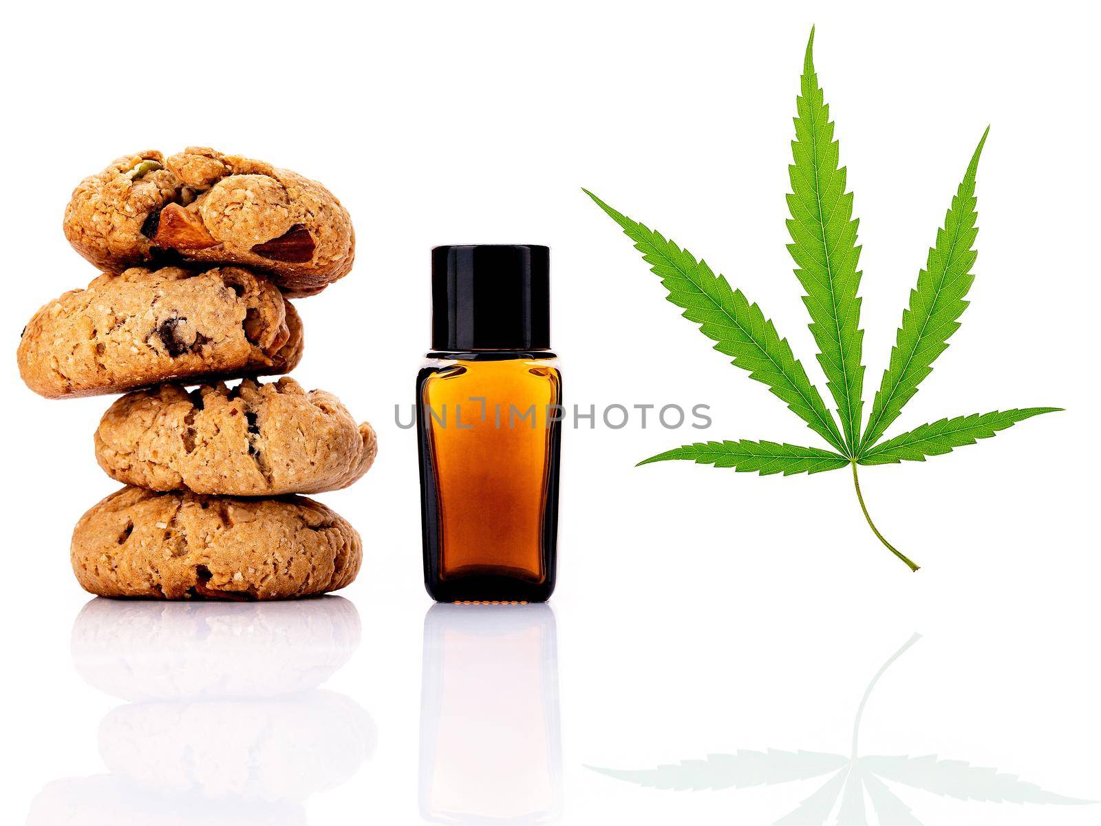 Homemade cannabis cookies with cannabis oils of marijuana  isolated on white background. Food conceptual  with cannabis herb. 