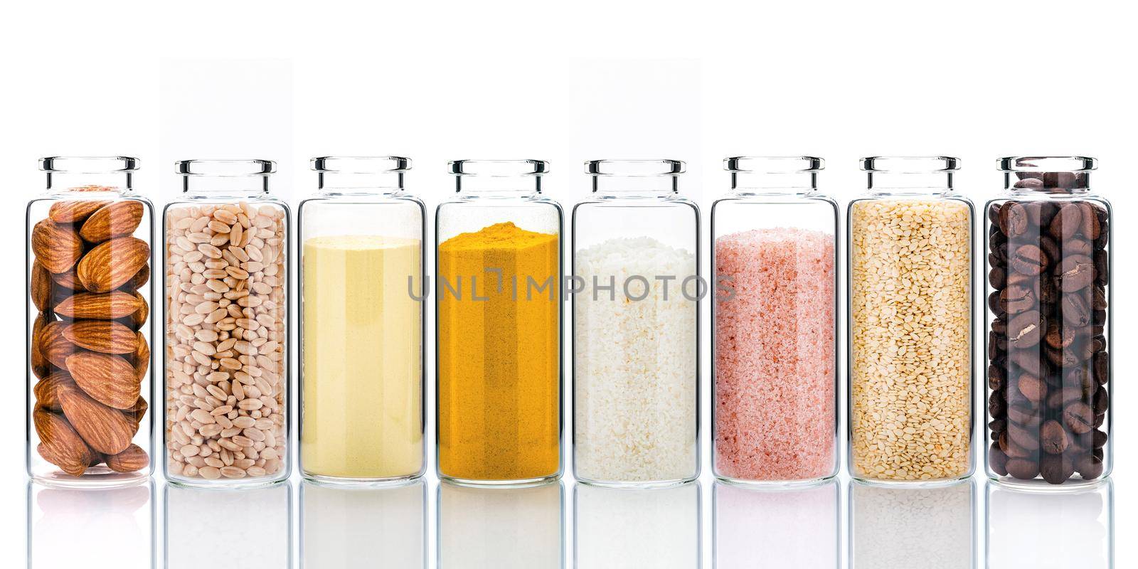 Homemade skin care with natural ingredients and herbs in glass bottles isolate on white background.