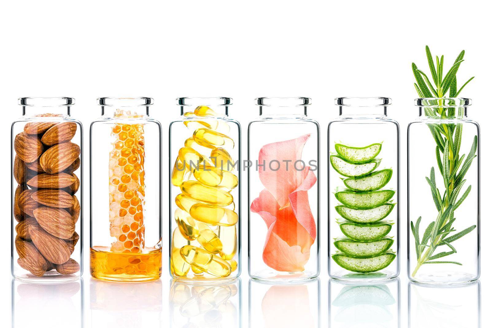 Homemade skin care with natural ingredients and herbs in glass bottles isolate on white background.