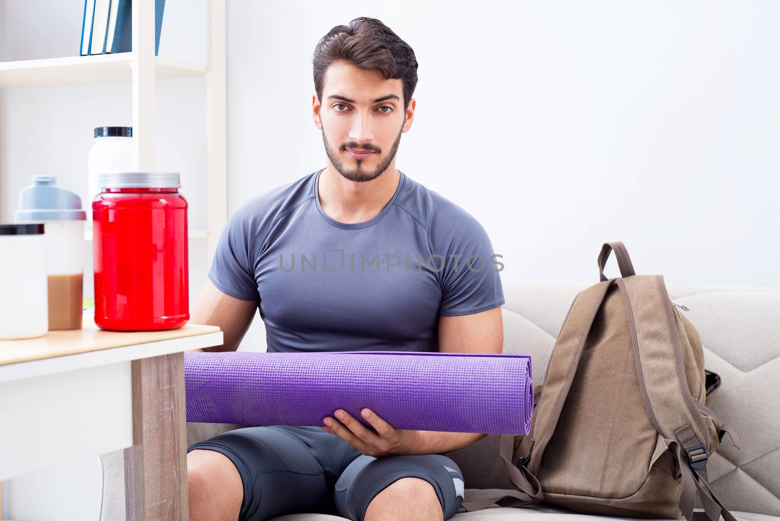 Young man getting ready for gym sports by Elnur