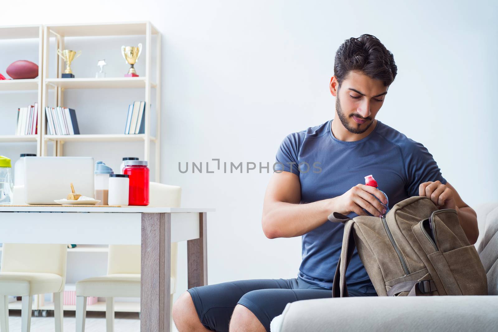 Young man getting ready for gym sports by Elnur