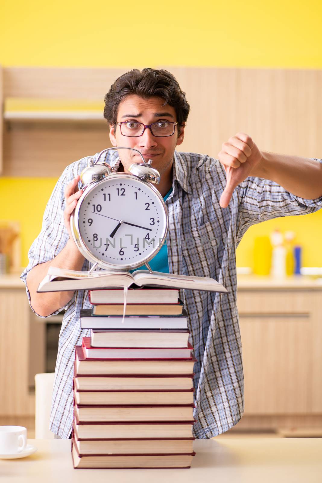 Student preparing for exam sitting at the kitchen 