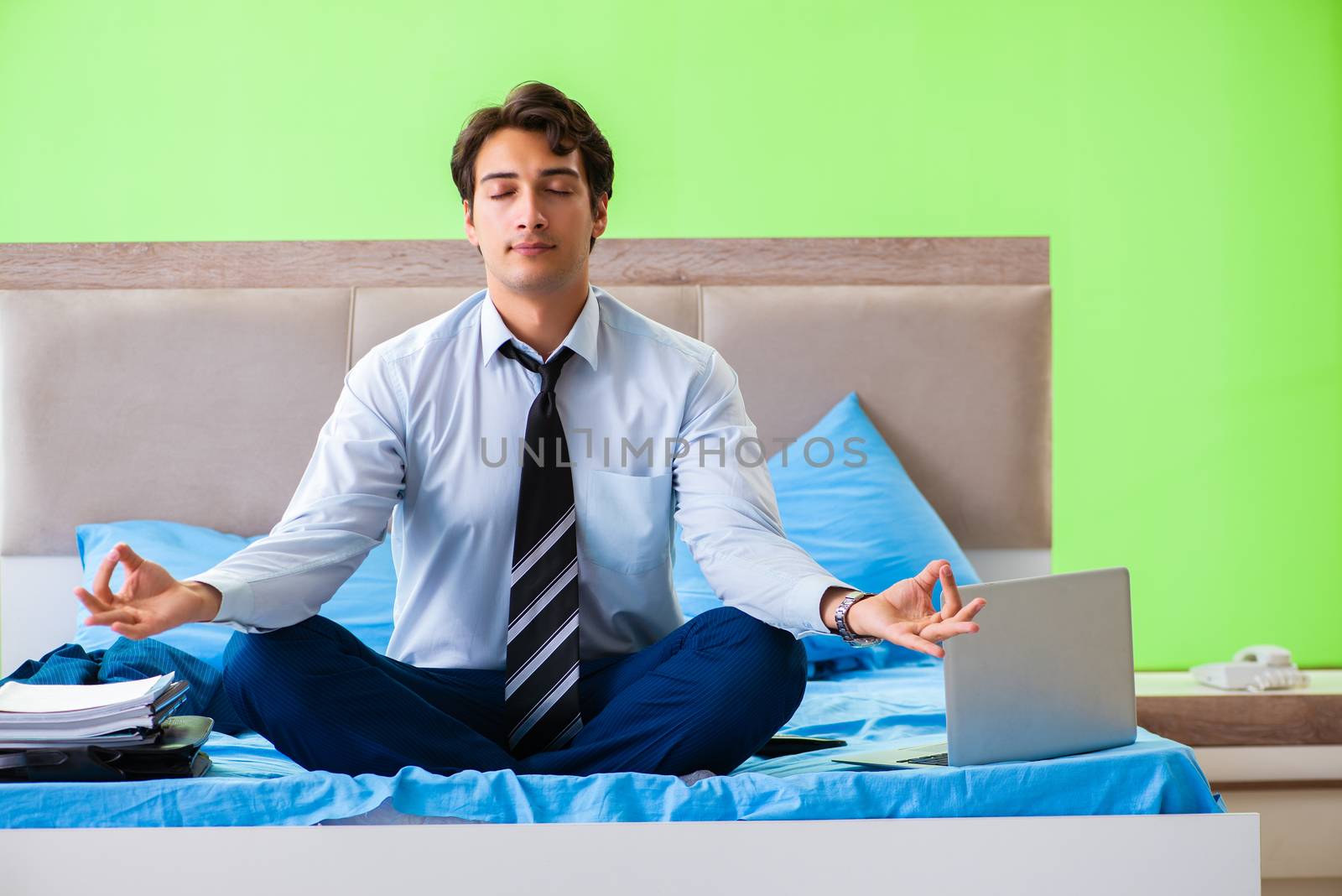 Businessman working in the hotel room