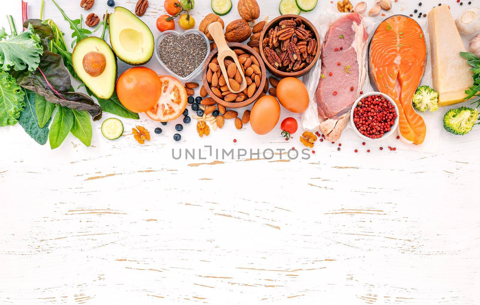 Ketogenic low carbs diet concept. Ingredients for healthy foods selection on white wooden background. Balanced healthy ingredients of unsaturated fats for the heart and blood vessels. by kerdkanno