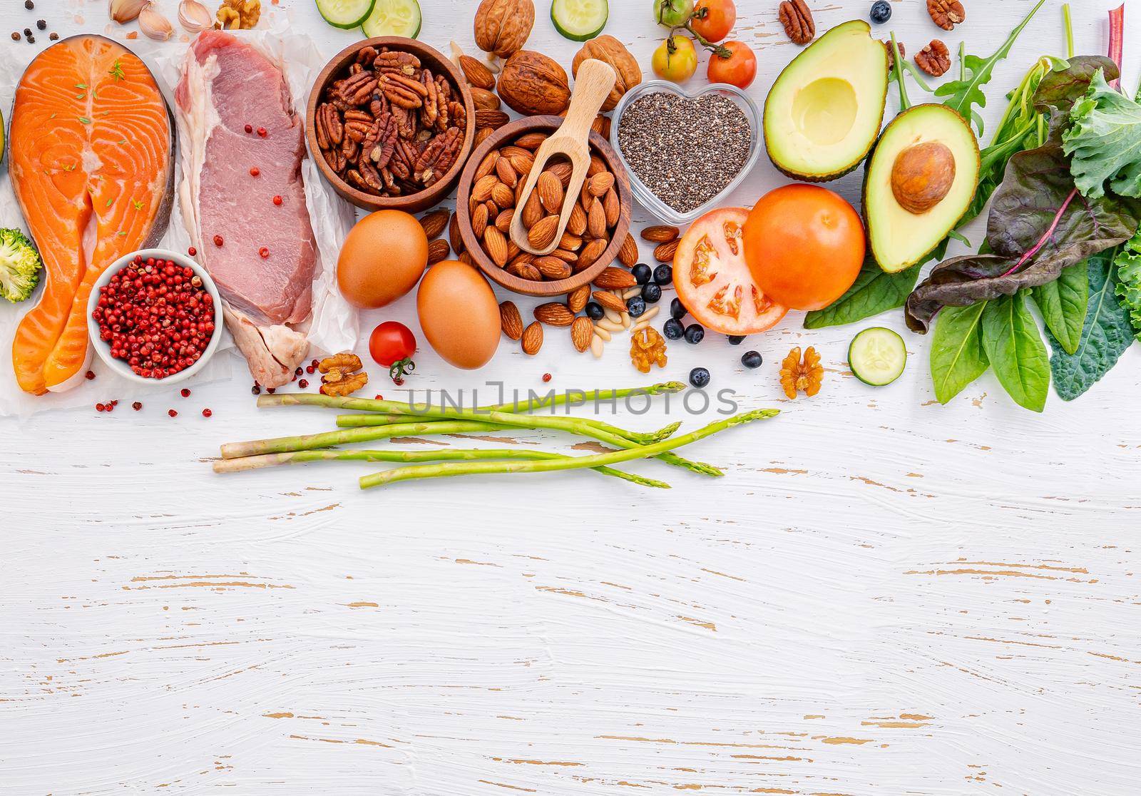 Ketogenic low carbs diet concept. Ingredients for healthy foods selection on white wooden background. Balanced healthy ingredients of unsaturated fats for the heart and blood vessels.