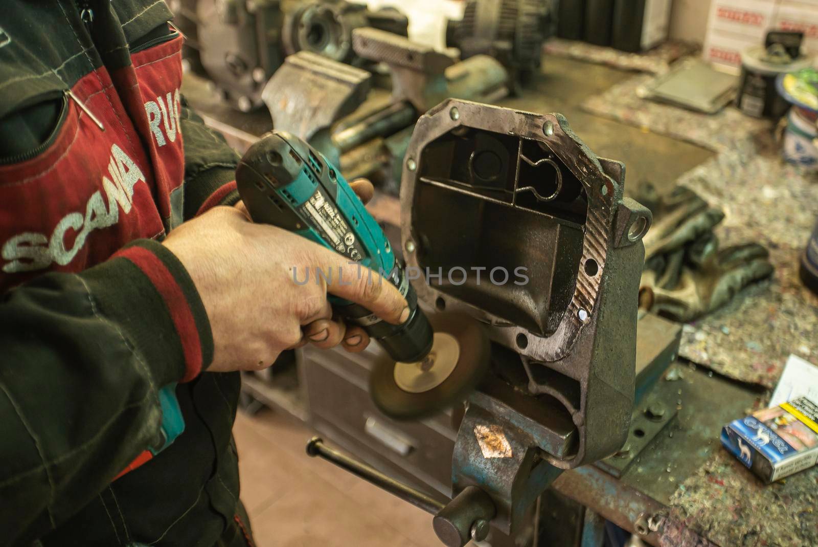 MILAN, ITALY 28 MARCH 2021: Mechanic cleans the spare part