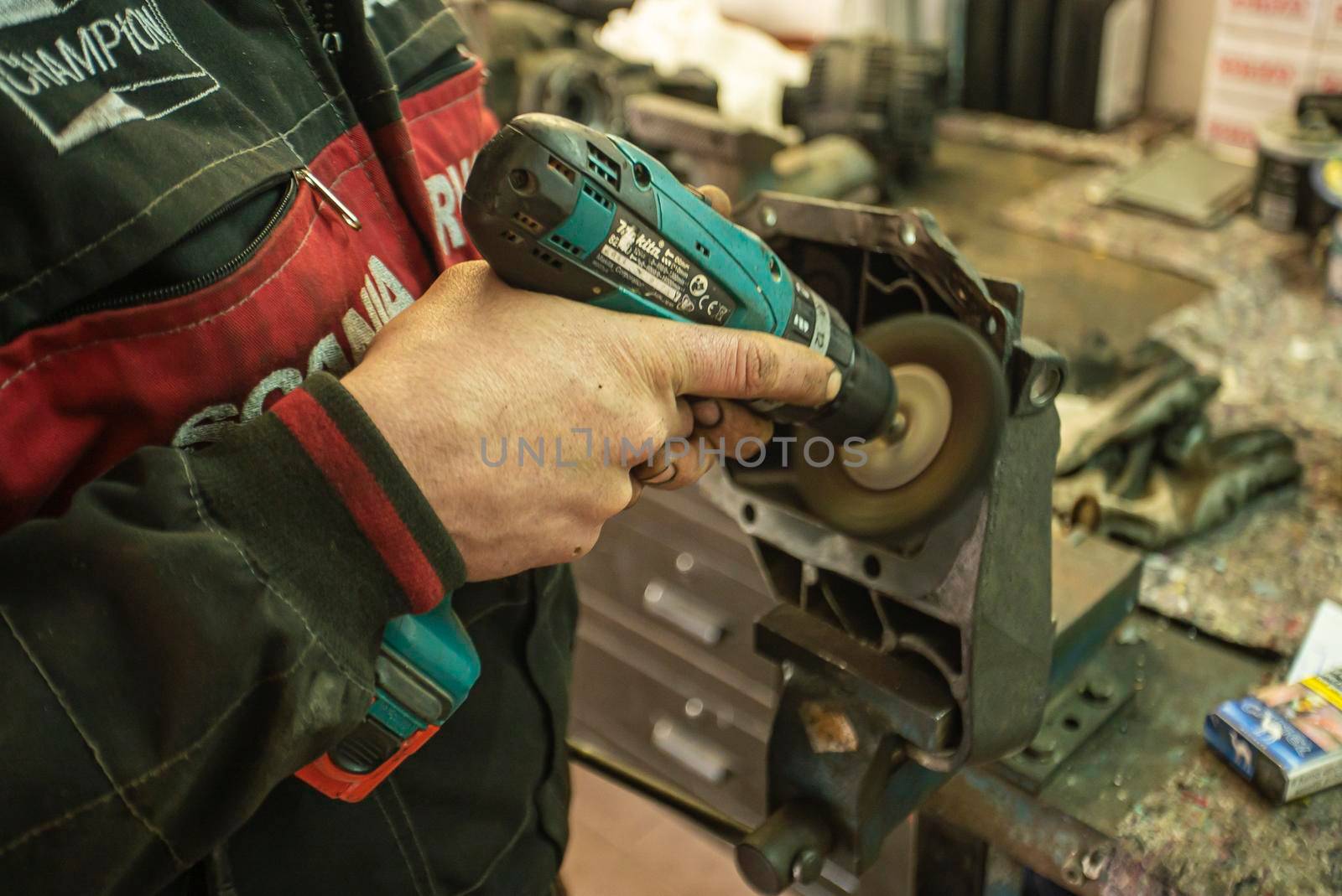 MILAN, ITALY 28 MARCH 2021: Mechanic cleans the spare part