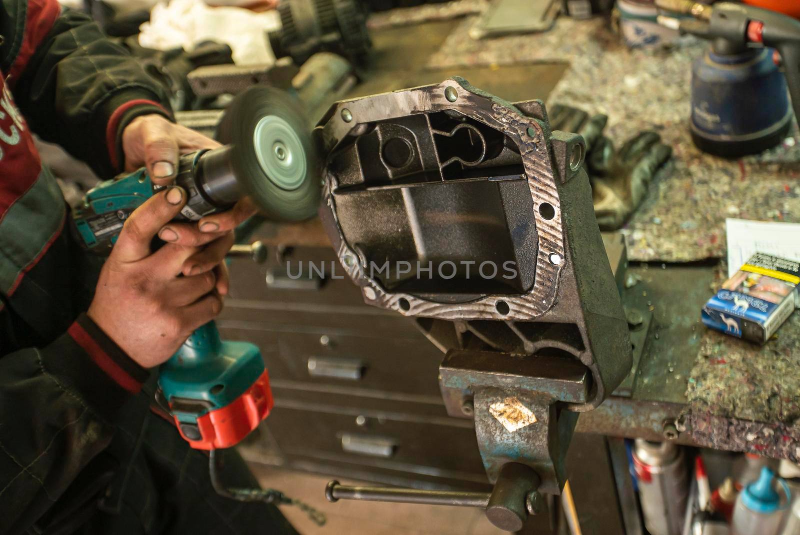 MILAN, ITALY 28 MARCH 2021: Mechanic cleans the spare part