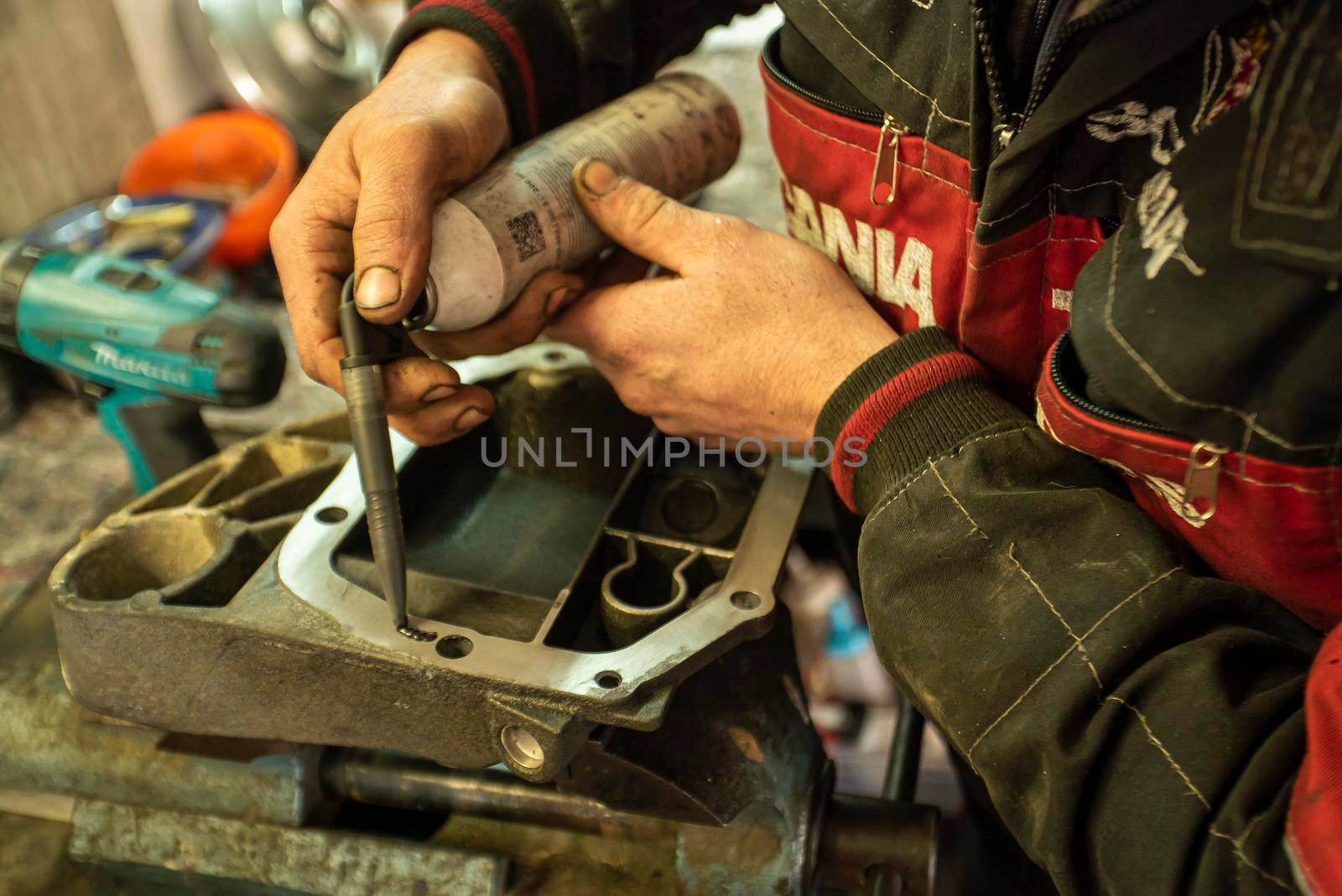 MILAN, ITALY 28 MARCH 2021: Mechanic repairs the gearbox