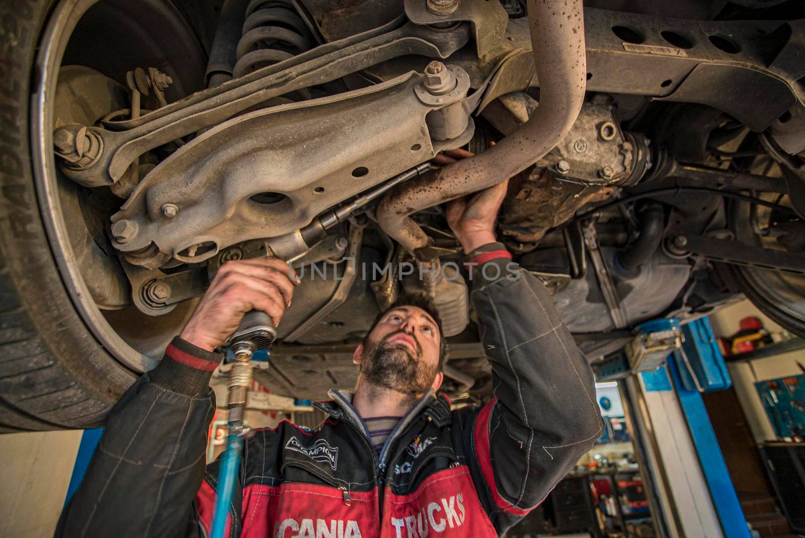 MILAN, ITALY 28 MARCH 2021: Mechanic repairs the car