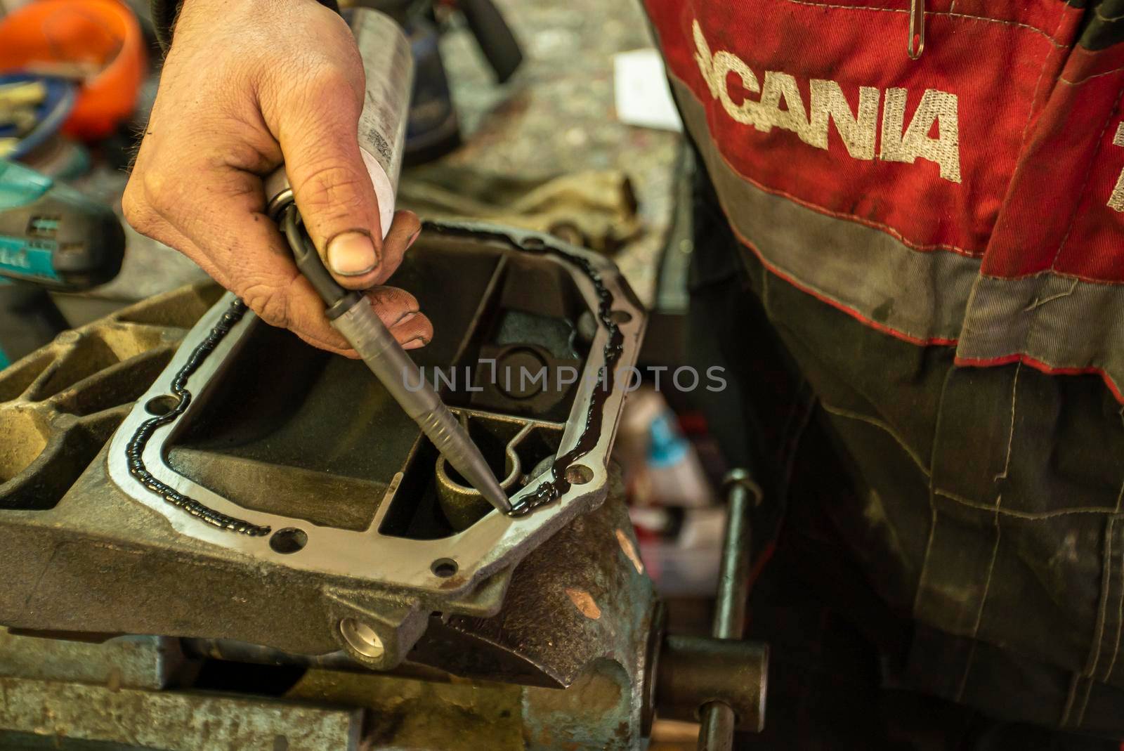 MILAN, ITALY 28 MARCH 2021: Mechanic repairs the gearbox