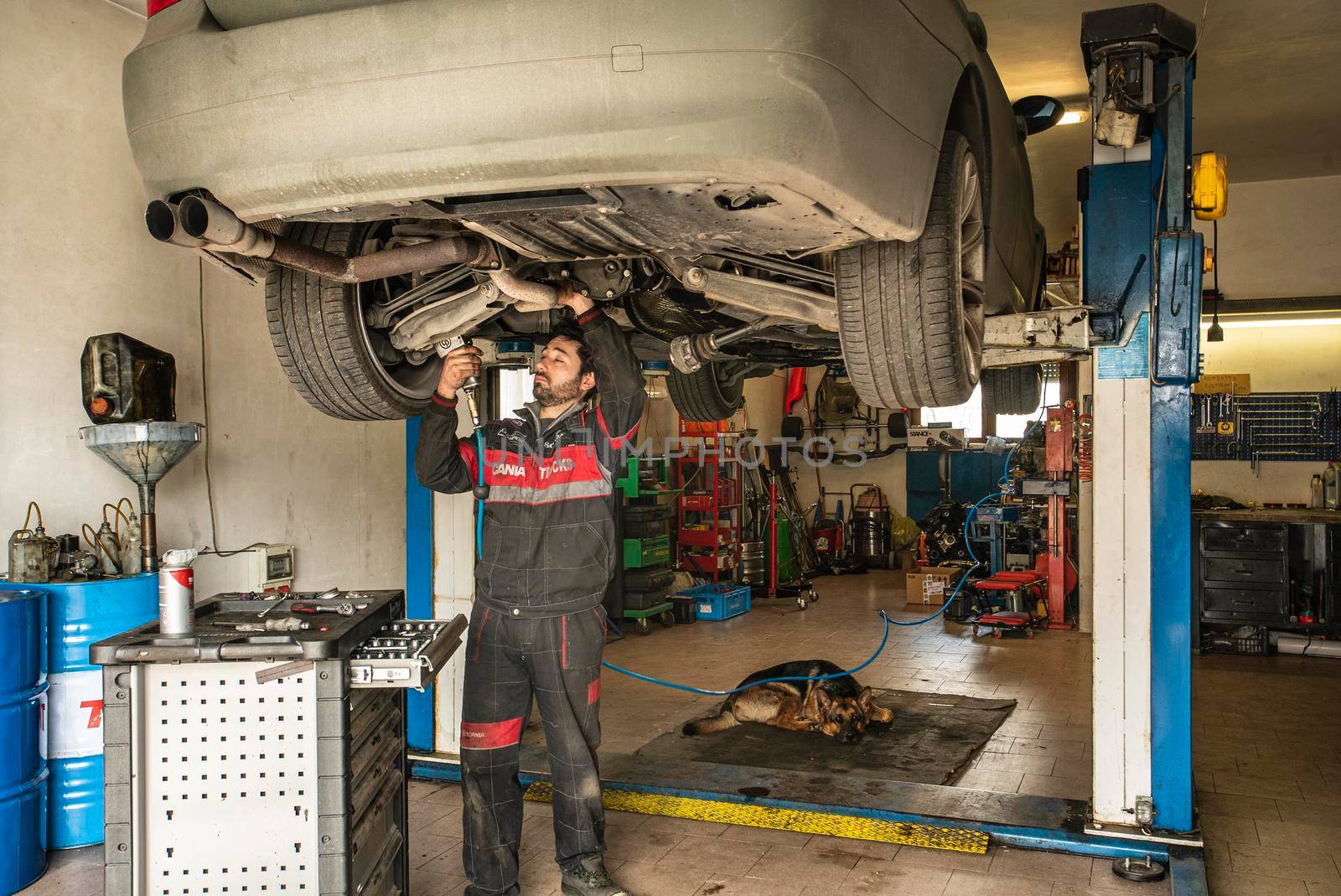 MILAN, ITALY 28 MARCH 2021: Mechanic repairs the car