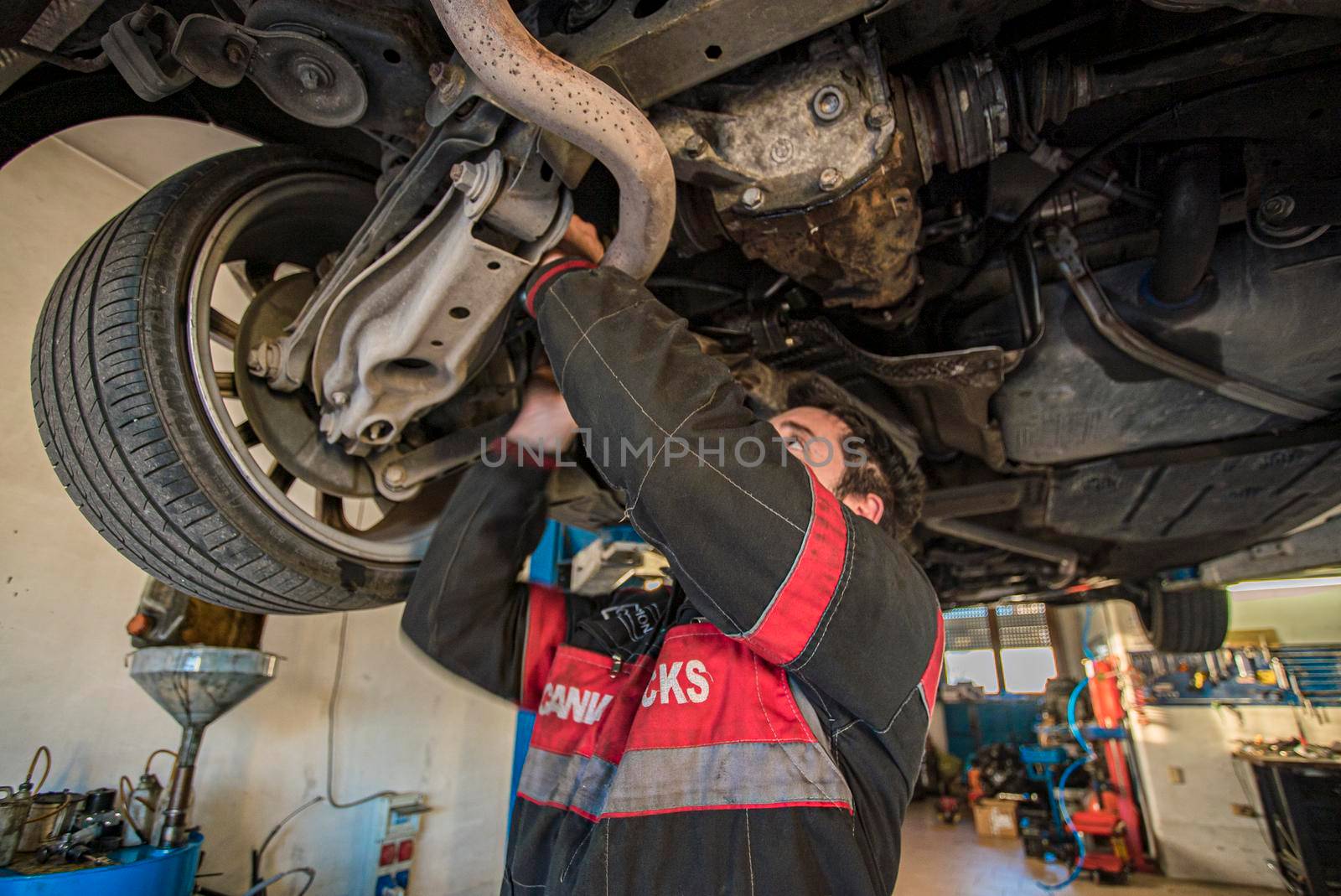 MILAN, ITALY 28 MARCH 2021: Mechanic repairs the car