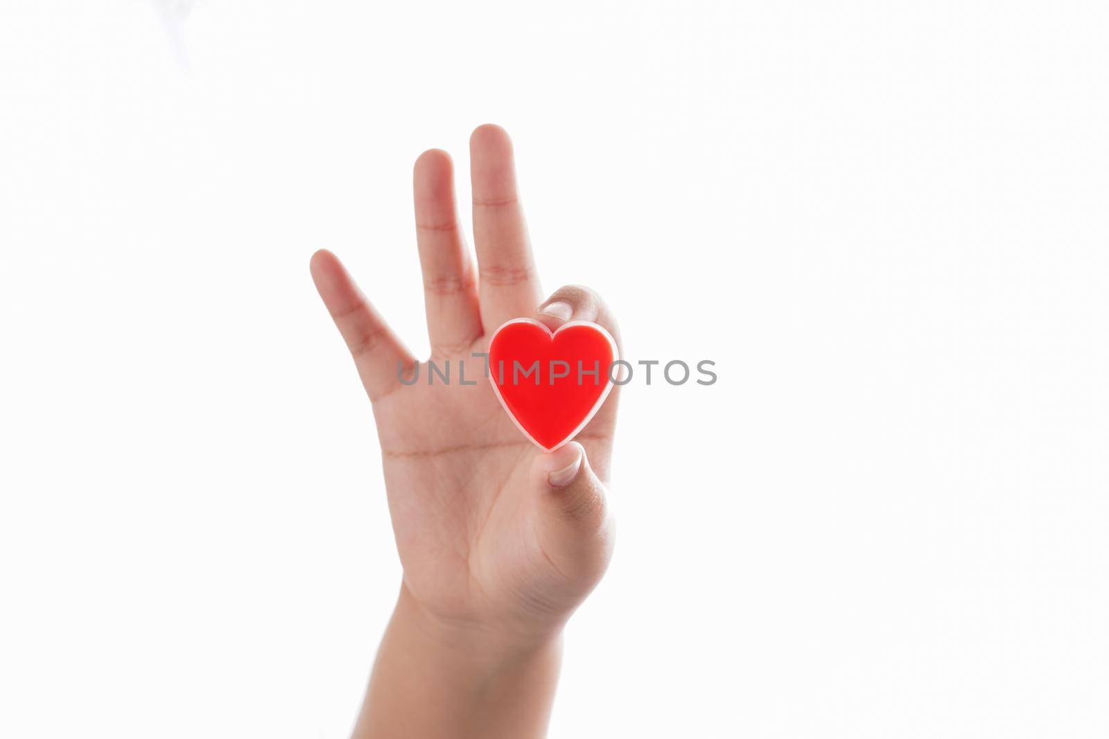 Hand holding a red heart of valentine's day concept