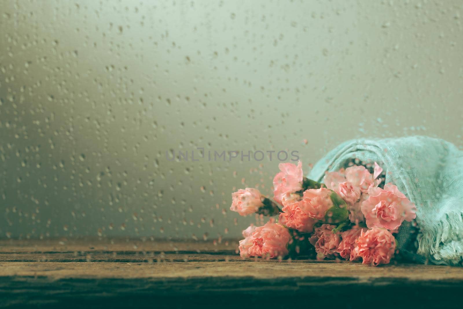 Still life with sweet carnation flowers on wooden table, Mothers day concept