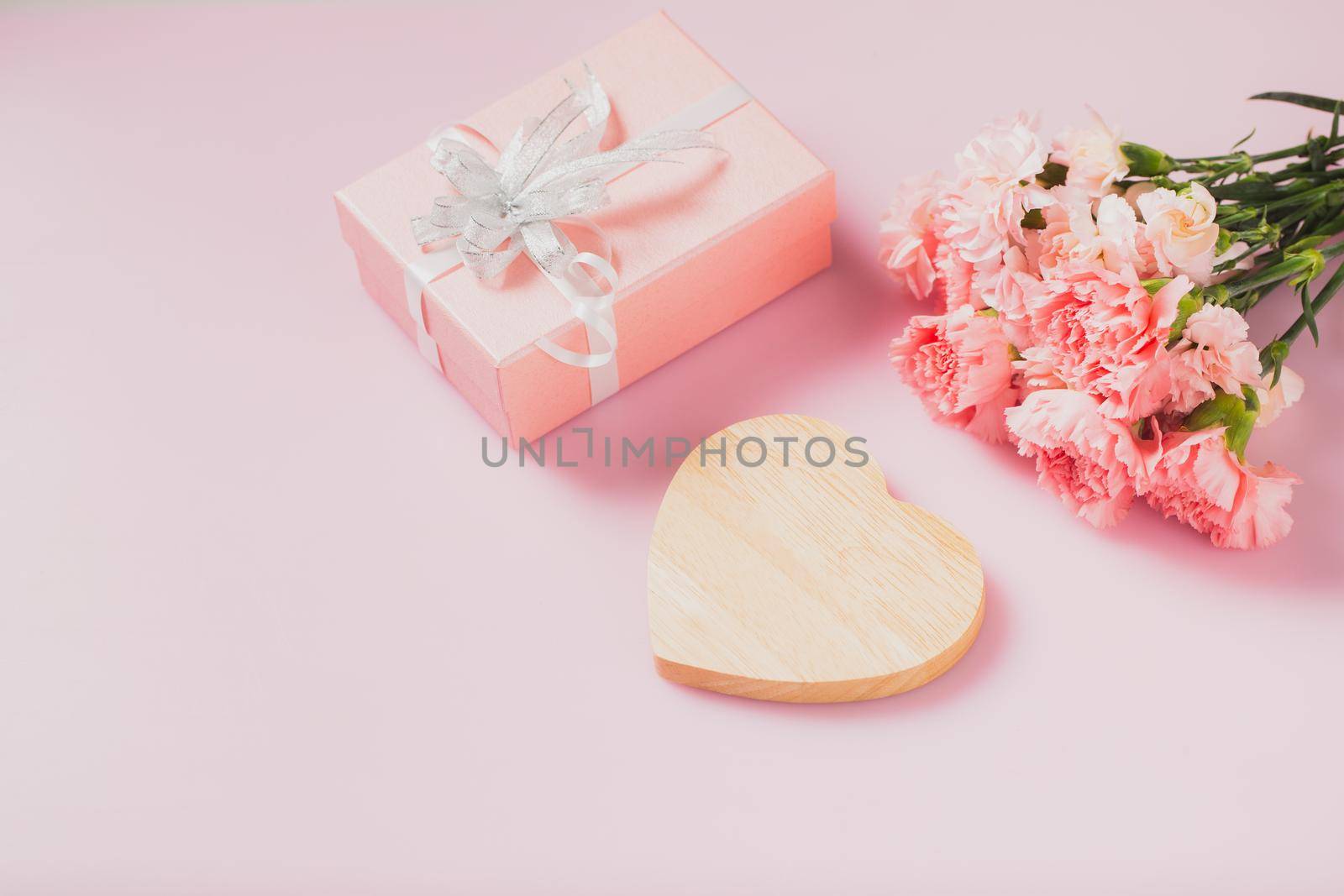 Heart wooden empty for message with gift box and Carnation flowers, Mother's Day and Valentines Day