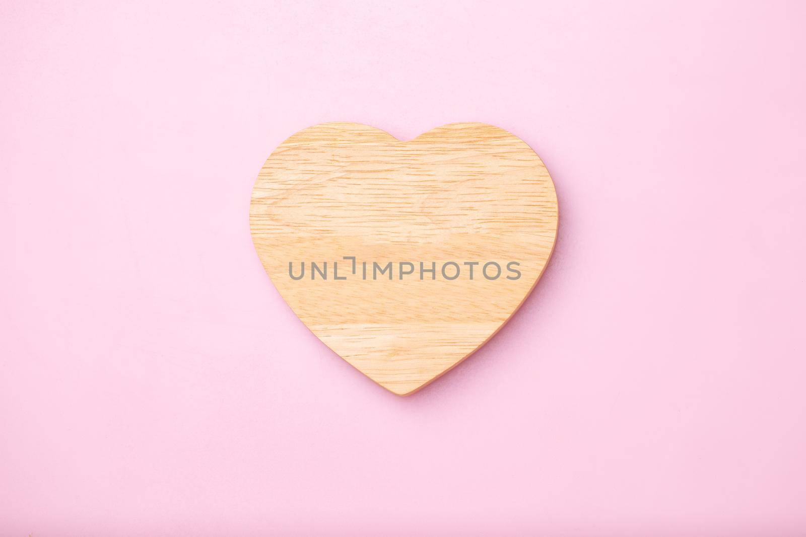 Heart wooden empty for message on pink background, Mother's Day and Valentines Day concept