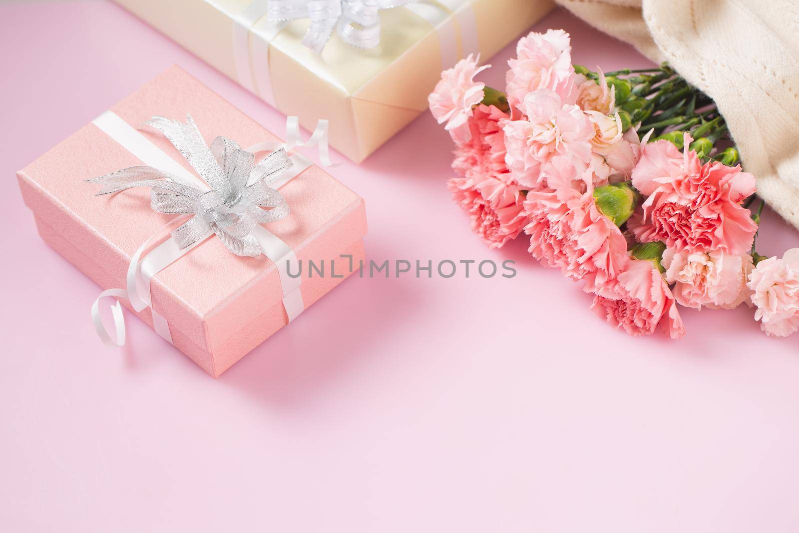 Gift box with carnation flowers, Mother's Day and Valentines Day concept