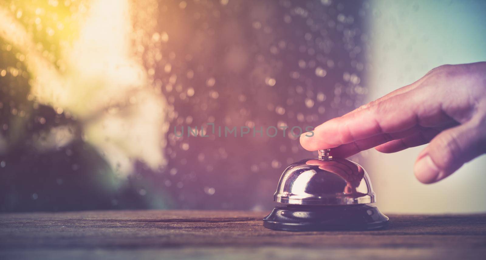 Bell of service with customer hand by Wasant