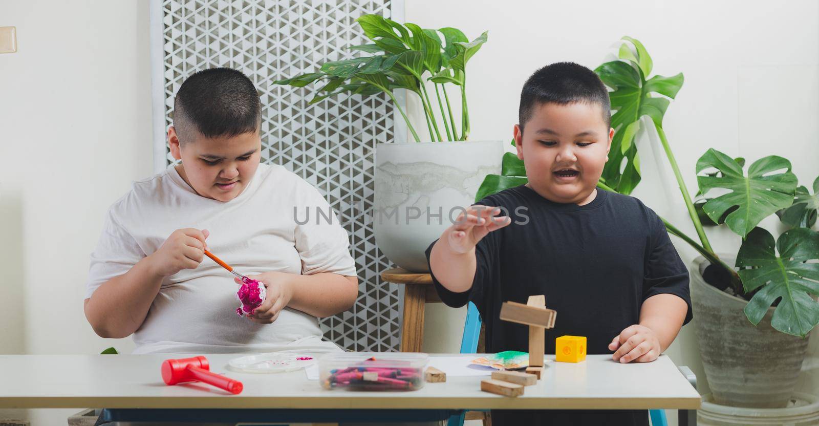 Brother and brother learn and do activities in the home.