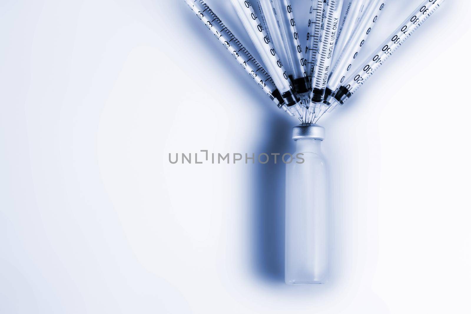 Syringe and vaccine on white background. The concept of a vaccine treatment for COVID-19