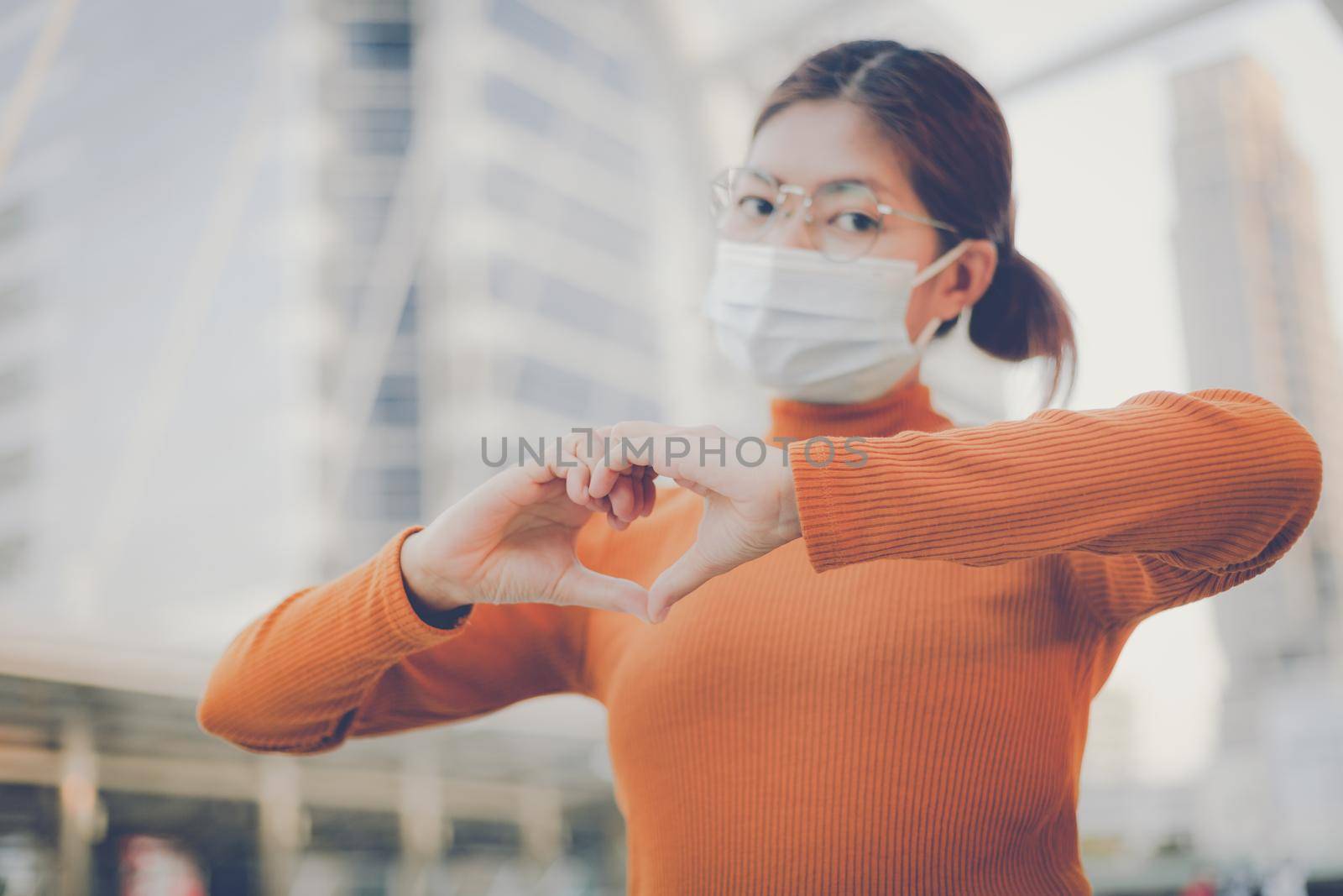 Woman making hands in heart shape, heart health insurance,social responsibility, donation, happy charity volunteer, world heart day, world mental health, cancer day, Valentines day