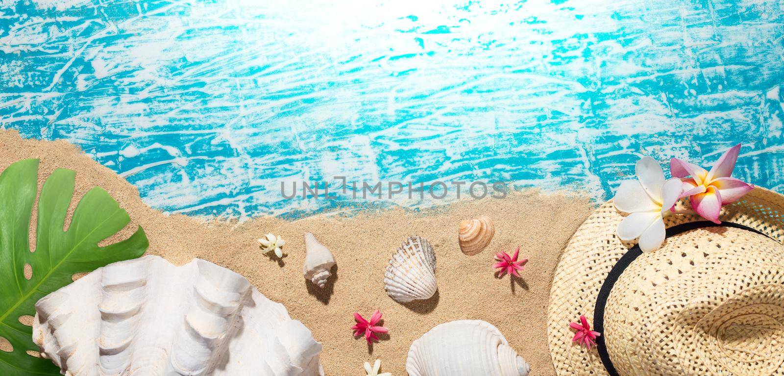 Summer concept, Beach accessories on the sand and blue wooden background with copy space